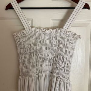 White and blue stripped top, slight peplum bottom, Alpha Omega, size S